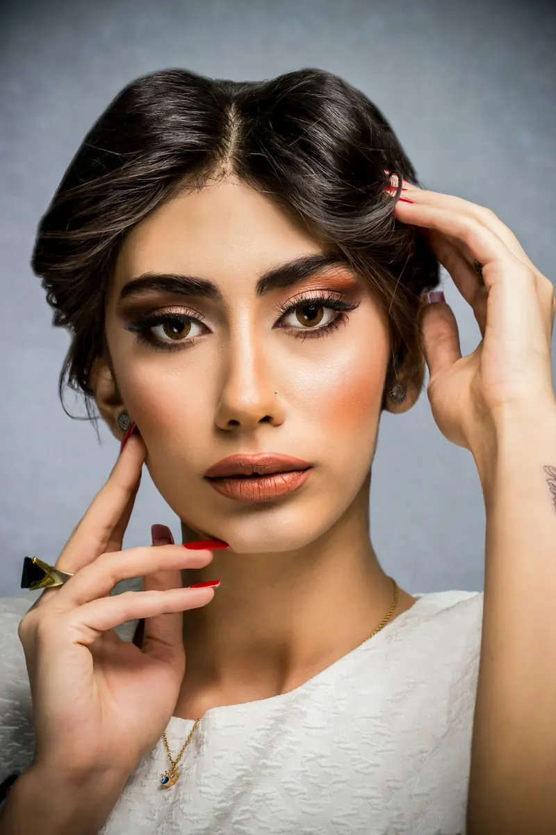 Beauty portrait of a model with her hands framing her face