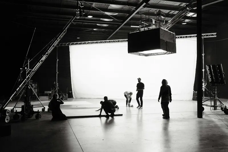 Large diffusion frame rigged above a film set